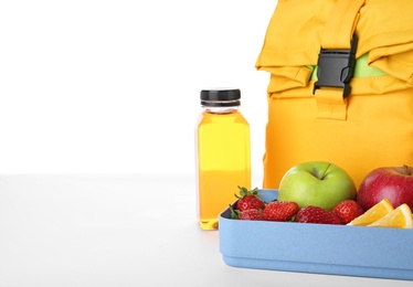 Photo of Lunch box with healthy food for schoolchild on white background. Space for text