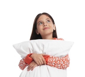 Cute girl wearing pajamas with pillow on white background