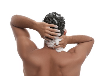 Man washing hair on white background, back view