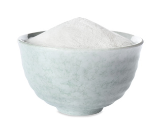 Photo of Baking soda in ceramic bowl isolated on white