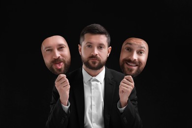 Image of Man holding masks with his face showing different emotions on black background. Balanced personality