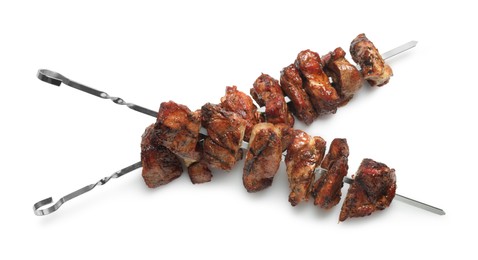 Metal skewers with delicious shish kebabs isolated on white, top view