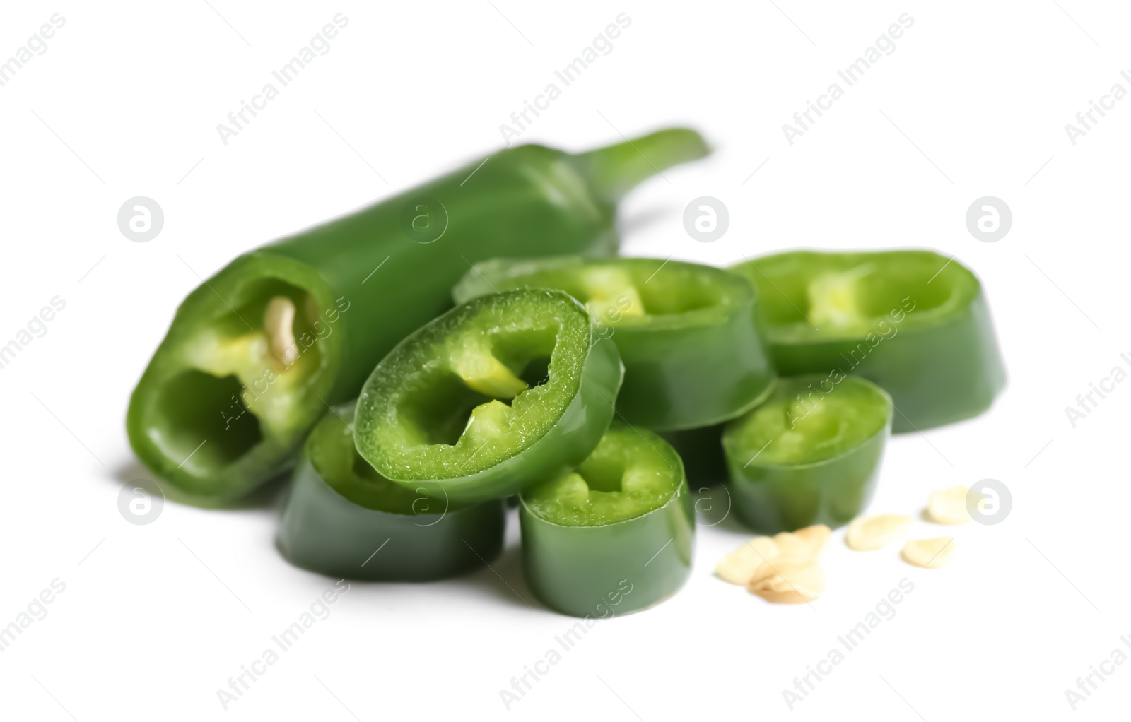 Photo of Cut green hot chili pepper on white background