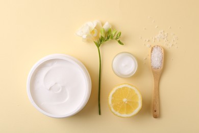 Photo of Flat lay composition with jars of cream on beige background. Body care product