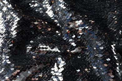 Photo of Texture of beautiful bright sequins as background, closeup