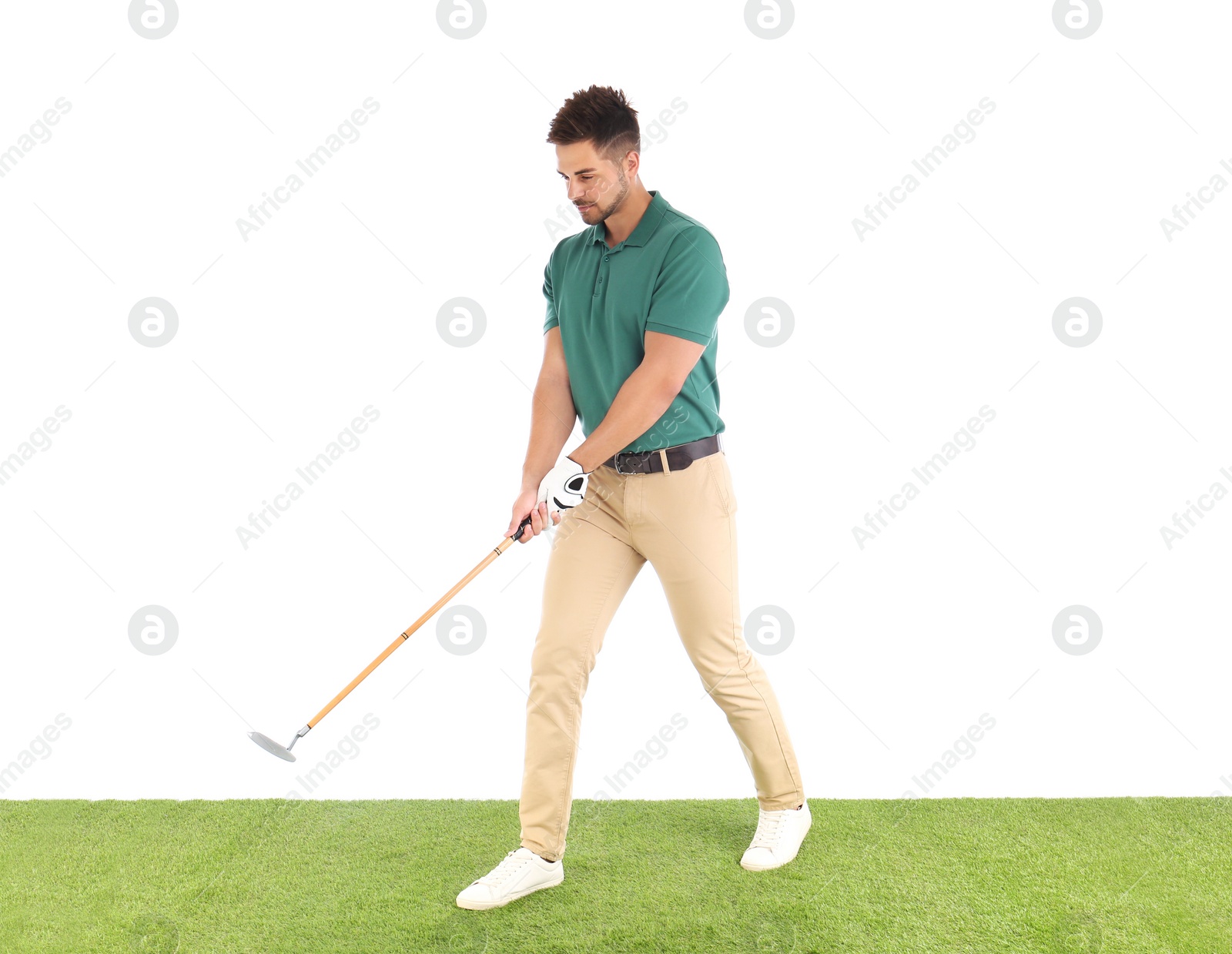 Photo of Young man playing golf on course against white background