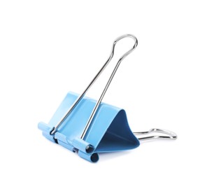 Photo of Light blue binder clip isolated on white. Stationery