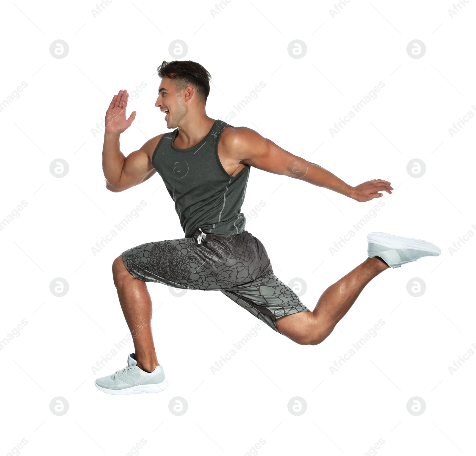 Photo of Handsome young man running on white background