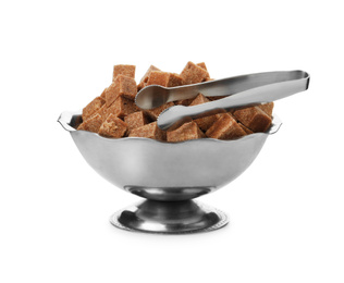Metal bowl with brown sugar cubes and tongs isolated on white