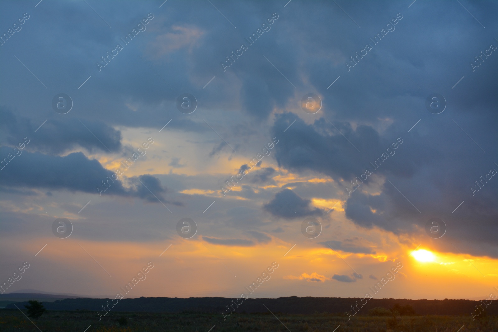 Photo of Picturesque view of beautiful countryside at sunset