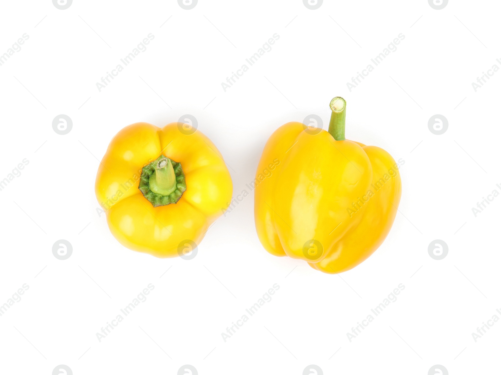 Photo of Ripe yellow bell peppers isolated on white, top view