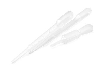 Three clean transfer pipettes isolated on white