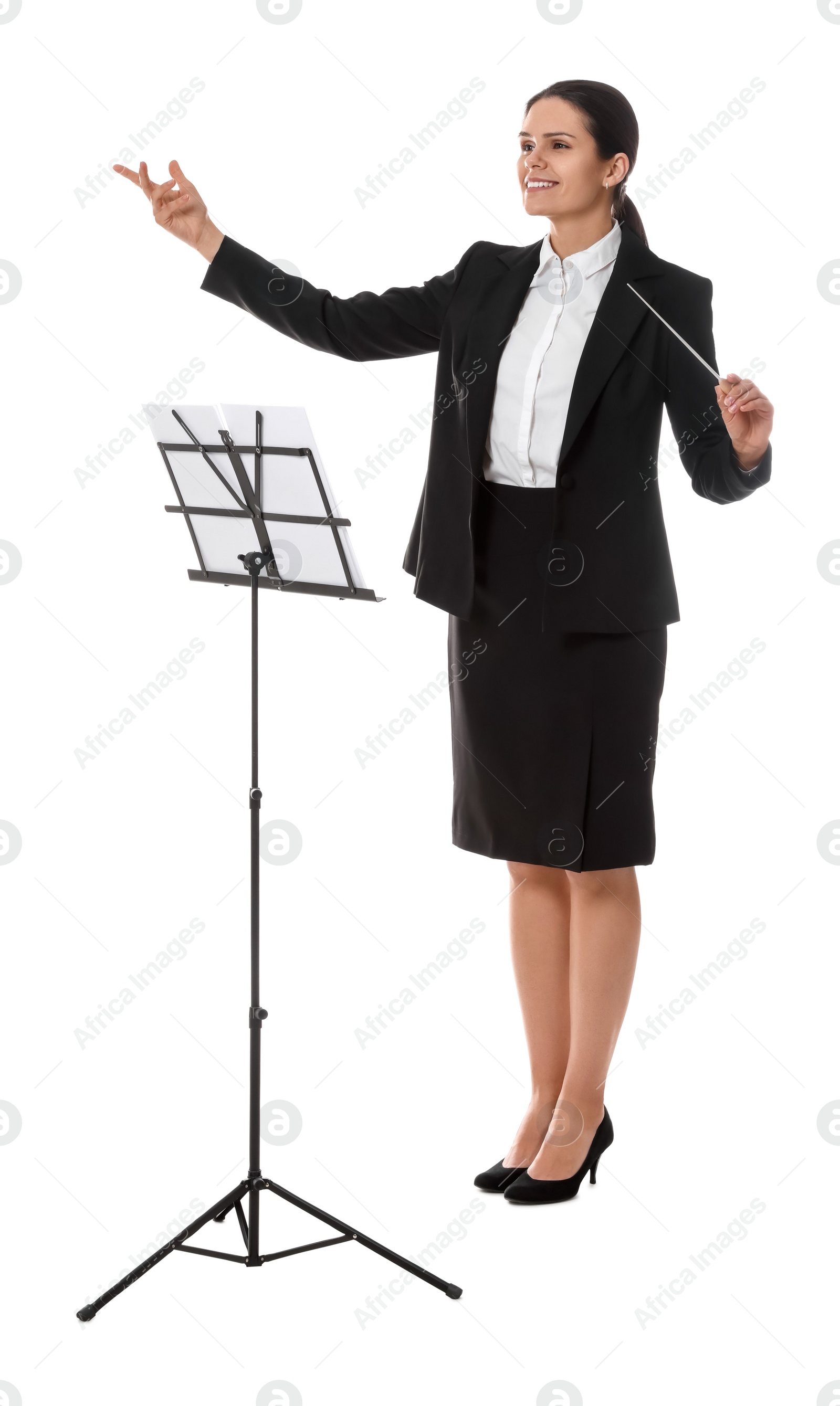 Photo of Happy young conductor with baton and note stand on white background