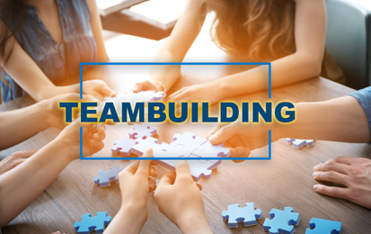 Image of People with puzzle, closeup of hands. Teambuilding concept