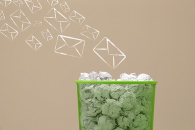 Image of Spam. Drawn envelopes falling into bin with crumpled paper on beige background