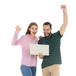 Photo of Emotional young people with laptop celebrating victory on white background