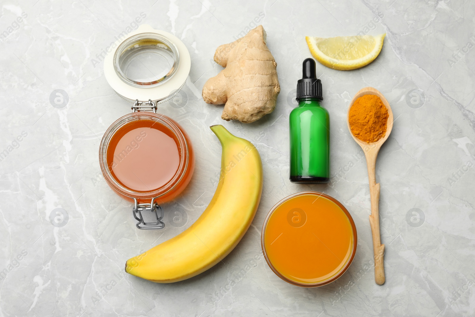 Photo of Different ingredients and handmade face mask on grey marble background, flat lay