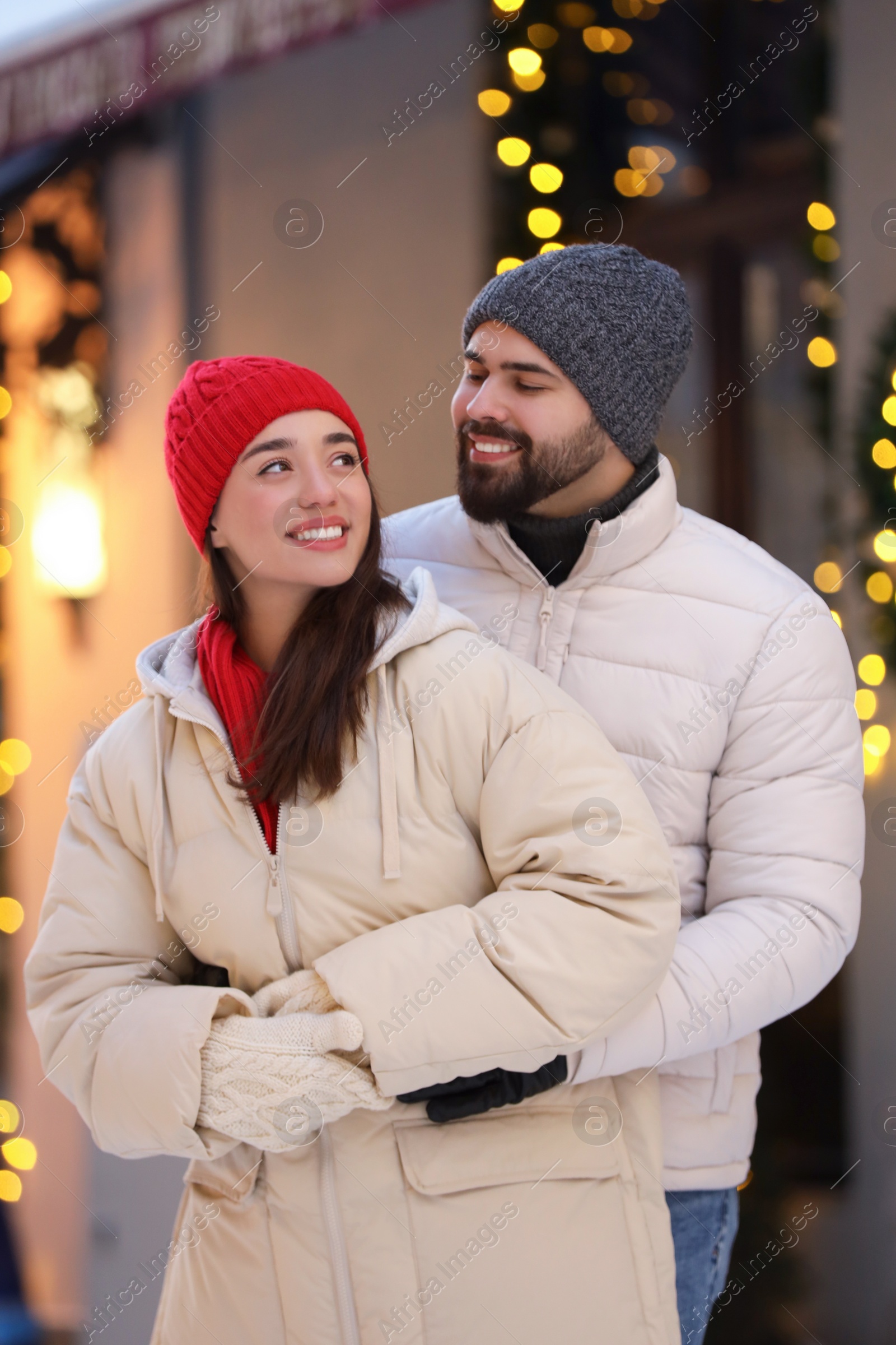 Photo of Lovely couple spending time together on city street