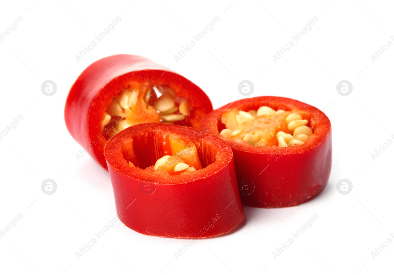 Photo of Slices of red chili pepper on white background