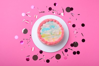 Photo of Cute bento cake with tasty cream and confetti on pink background, flat lay