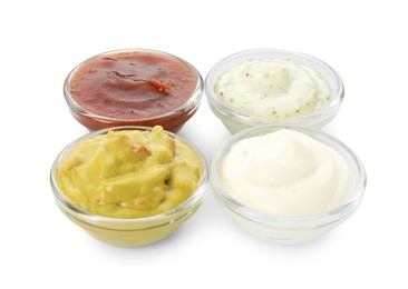 Many different sauces in bowls on white background
