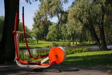 Outdoor gym with exercise machine in park