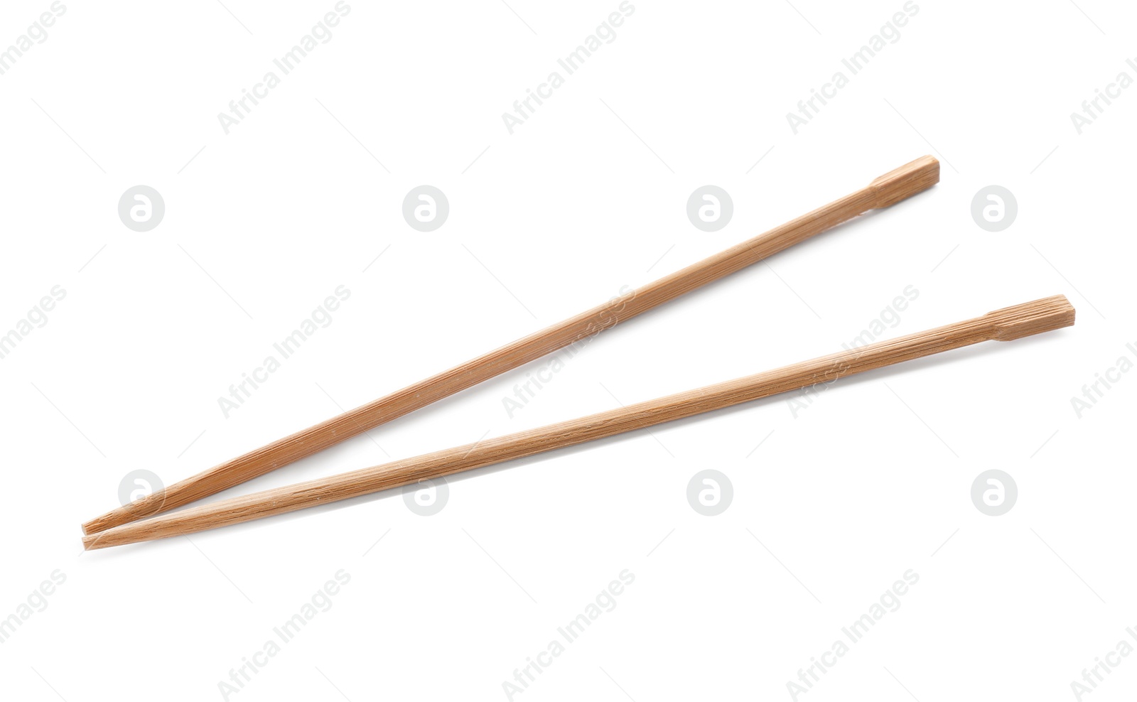 Photo of Chopsticks made of bamboo on white background