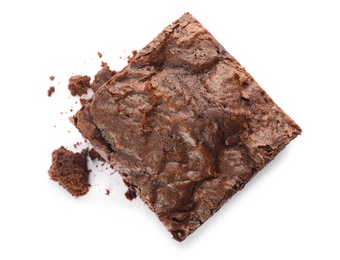 Piece of fresh brownie on white background, top view. Delicious chocolate pie