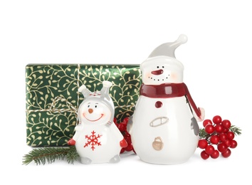 Photo of Christmas composition with decorative snowmen and gift box on white background