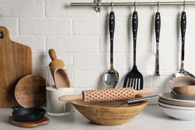 Different cooking utensils on countertop in kitchen