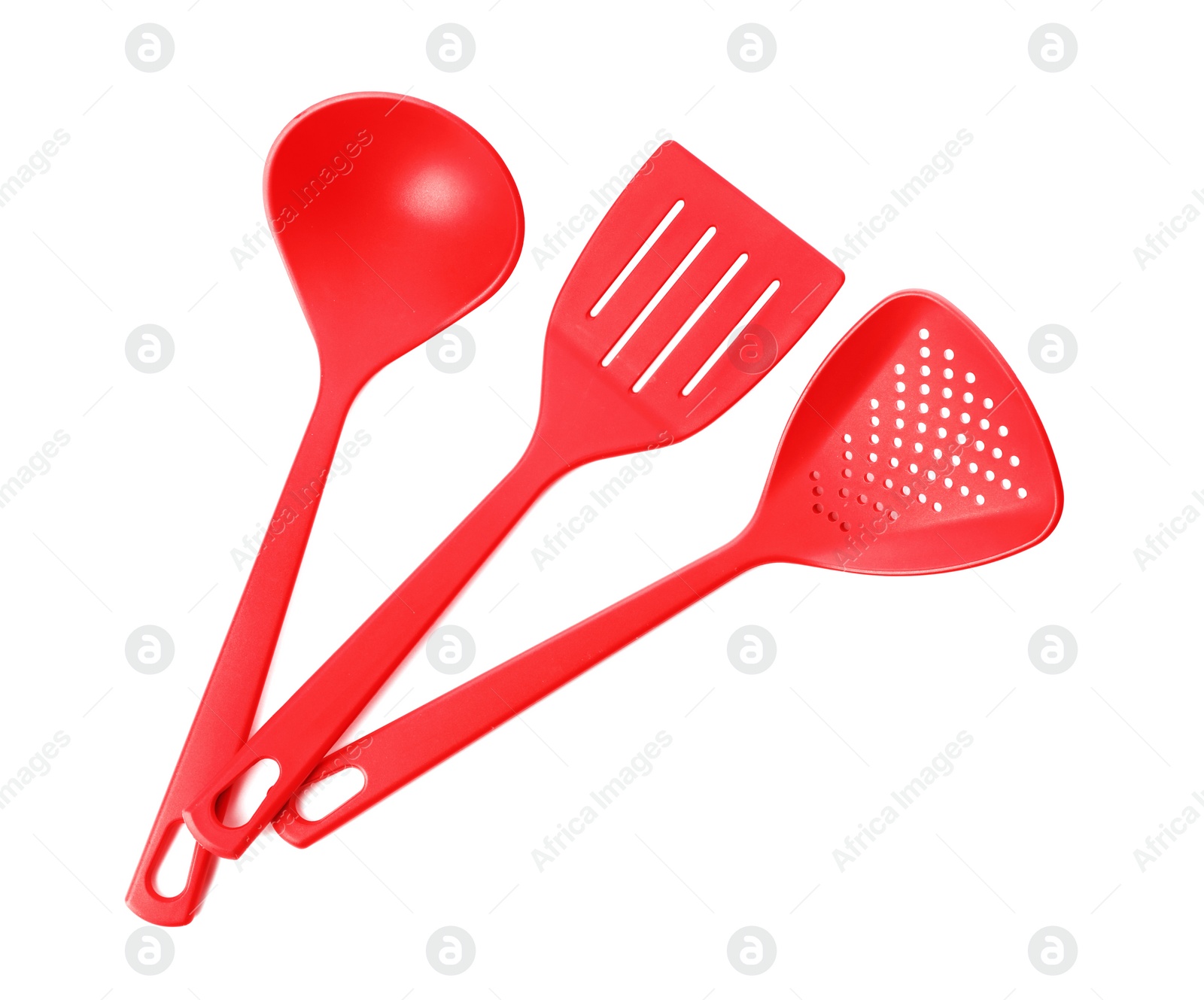 Photo of Different colorful kitchen utensils on white background