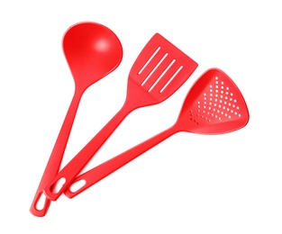 Photo of Different colorful kitchen utensils on white background