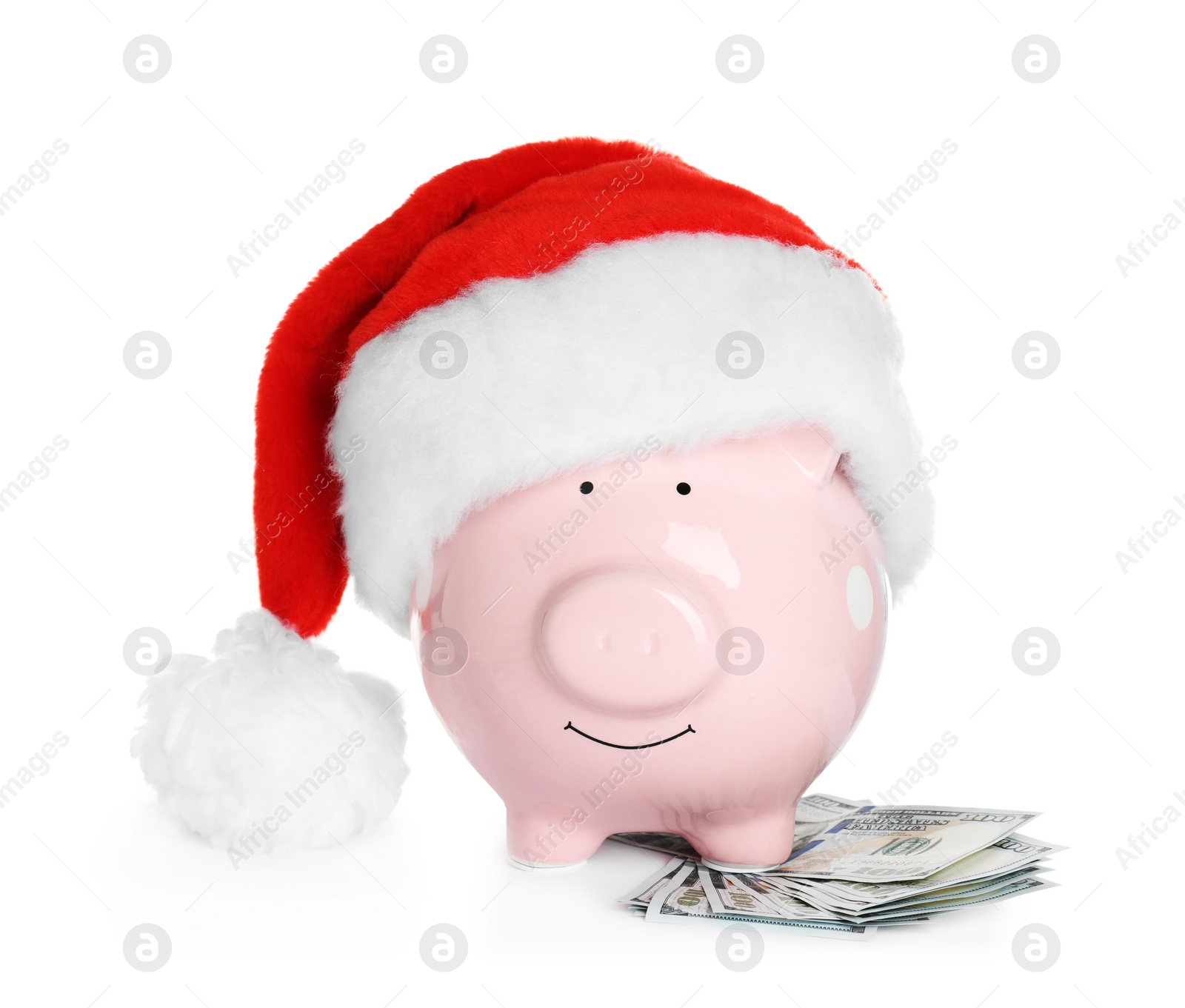 Photo of Piggy bank with Santa hat and dollar banknotes on white background