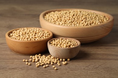 Photo of Natural organic soy beans on wooden table