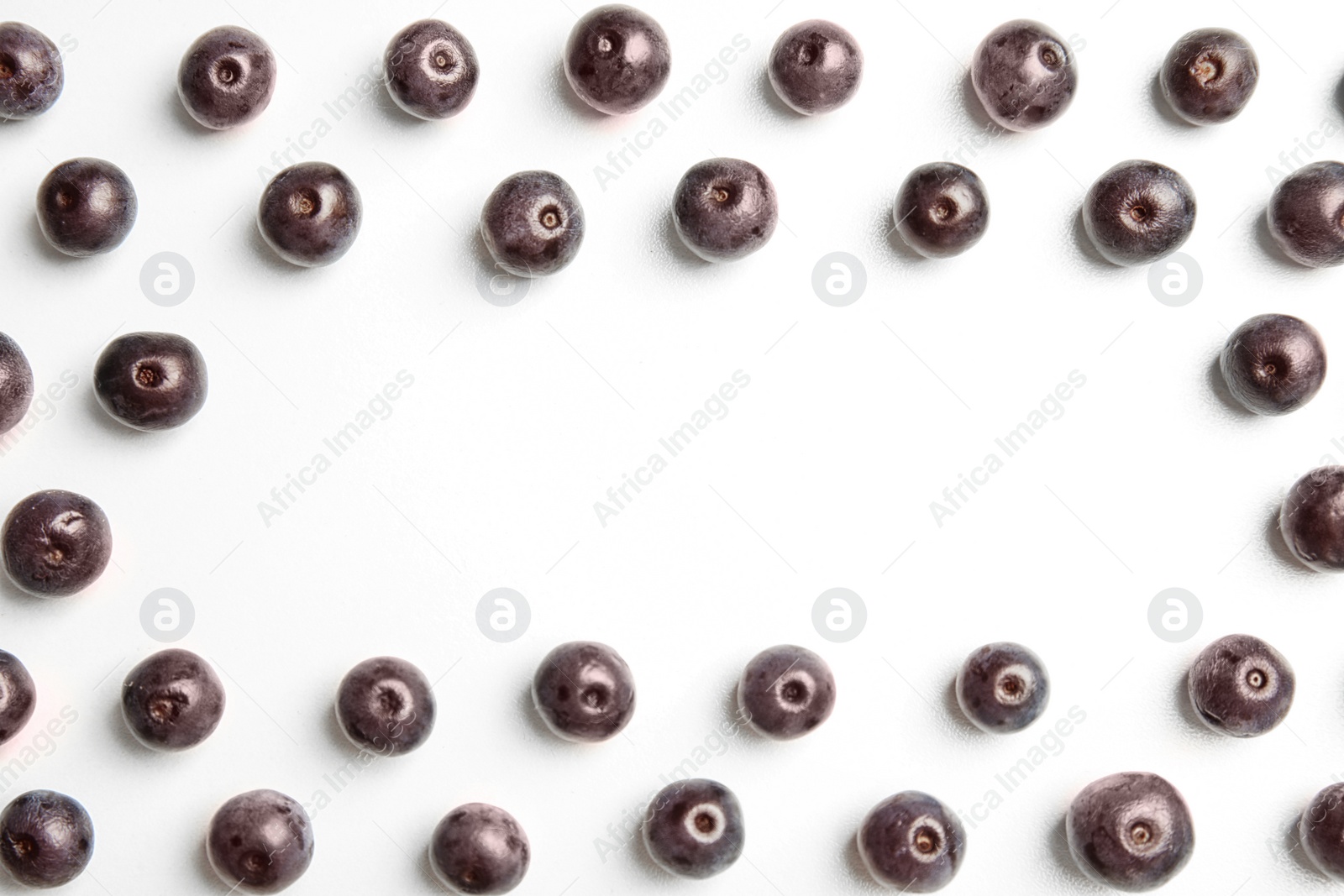 Photo of Fresh acai berries on white background