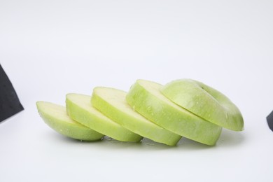 Sliced ripe green apple isolated on white