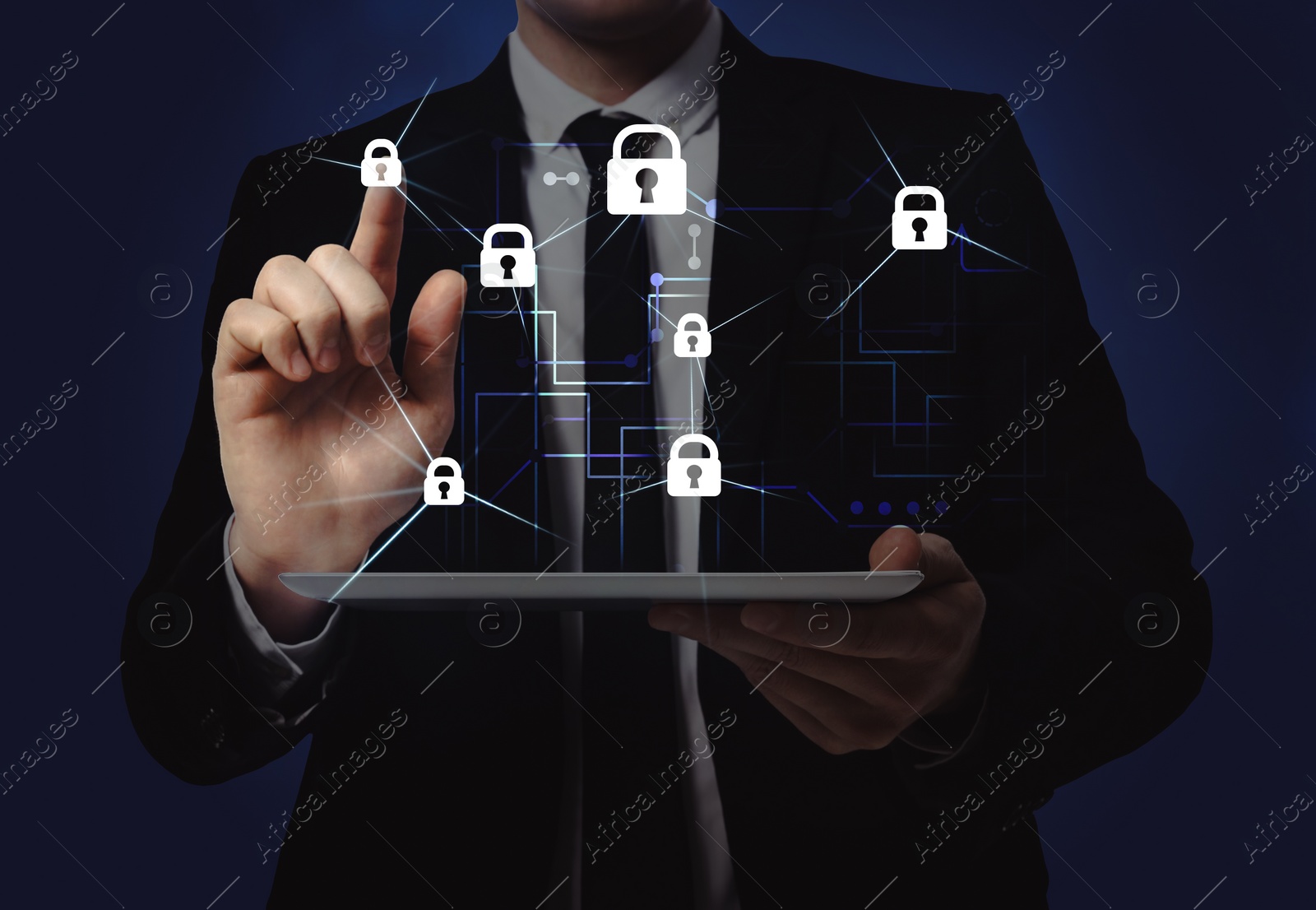Image of Privacy protection. Man using tablet and touching icon of padlock on dark blue background, closeup. Digital scheme over device