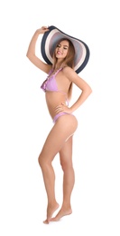 Pretty sexy woman in stylish bikini with hat on white background