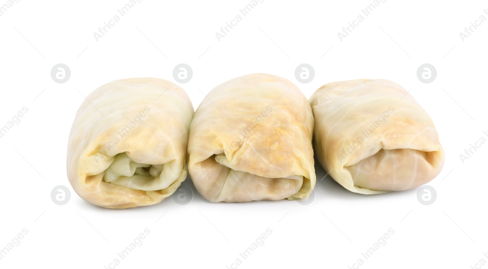 Photo of Uncooked stuffed cabbage rolls on white background