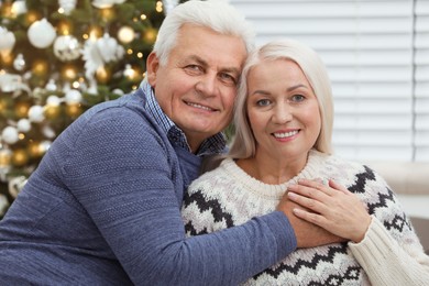 Happy mature couple at home. Christmas celebration