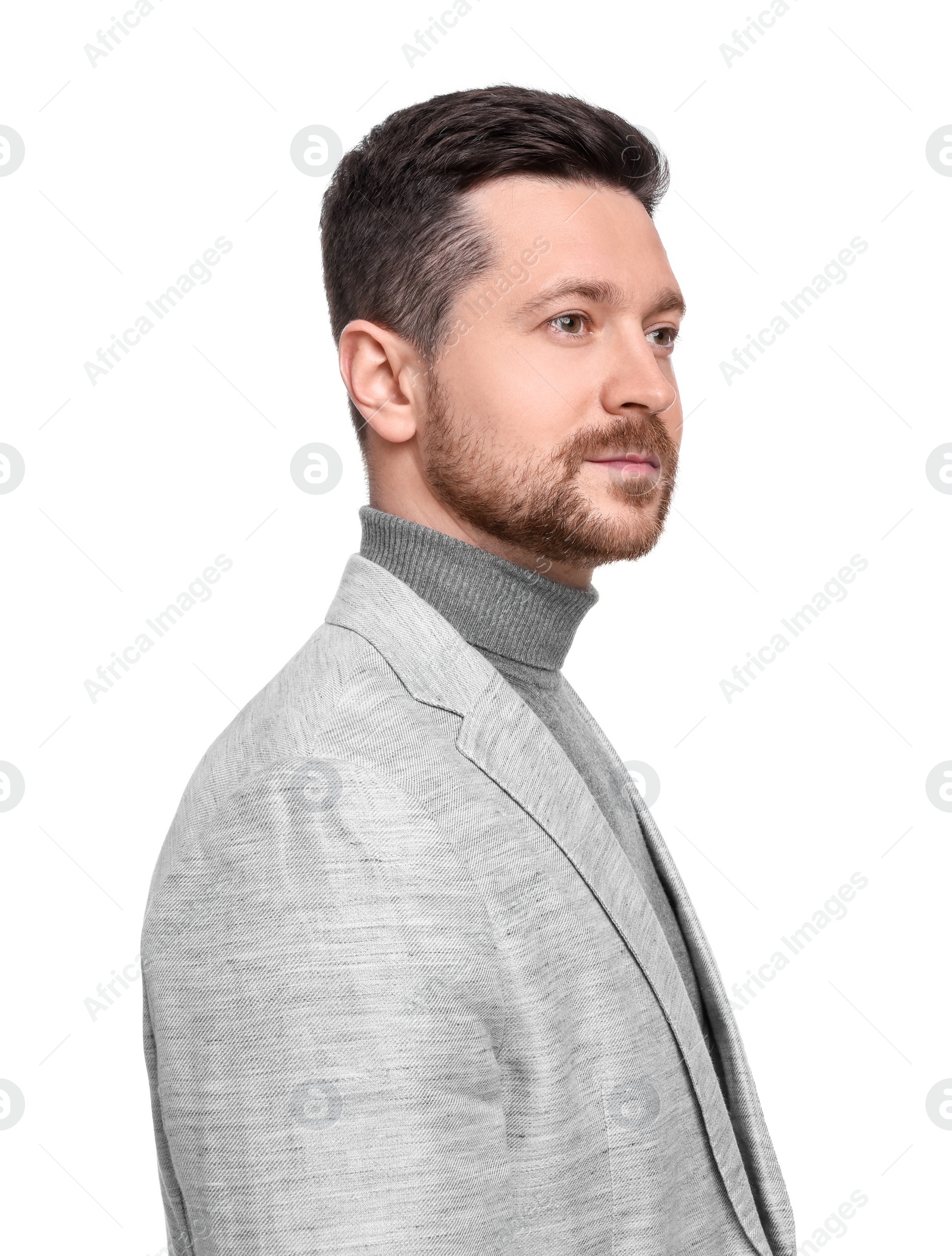 Photo of Handsome bearded businessman in suit on white background