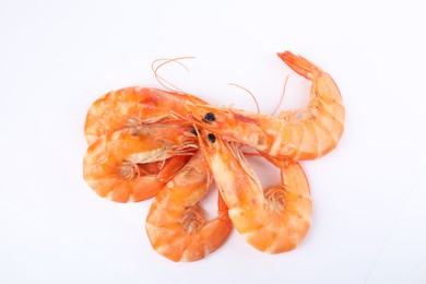 Delicious cooked shrimps isolated on white, top view