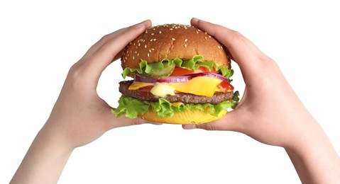 Photo of Woman holding delicious burger with beef patty and lettuce on white background, closeup