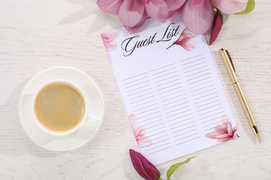 Guest list, coffee, pen and beautiful flowers on white wooden table, flat lay. Space for text