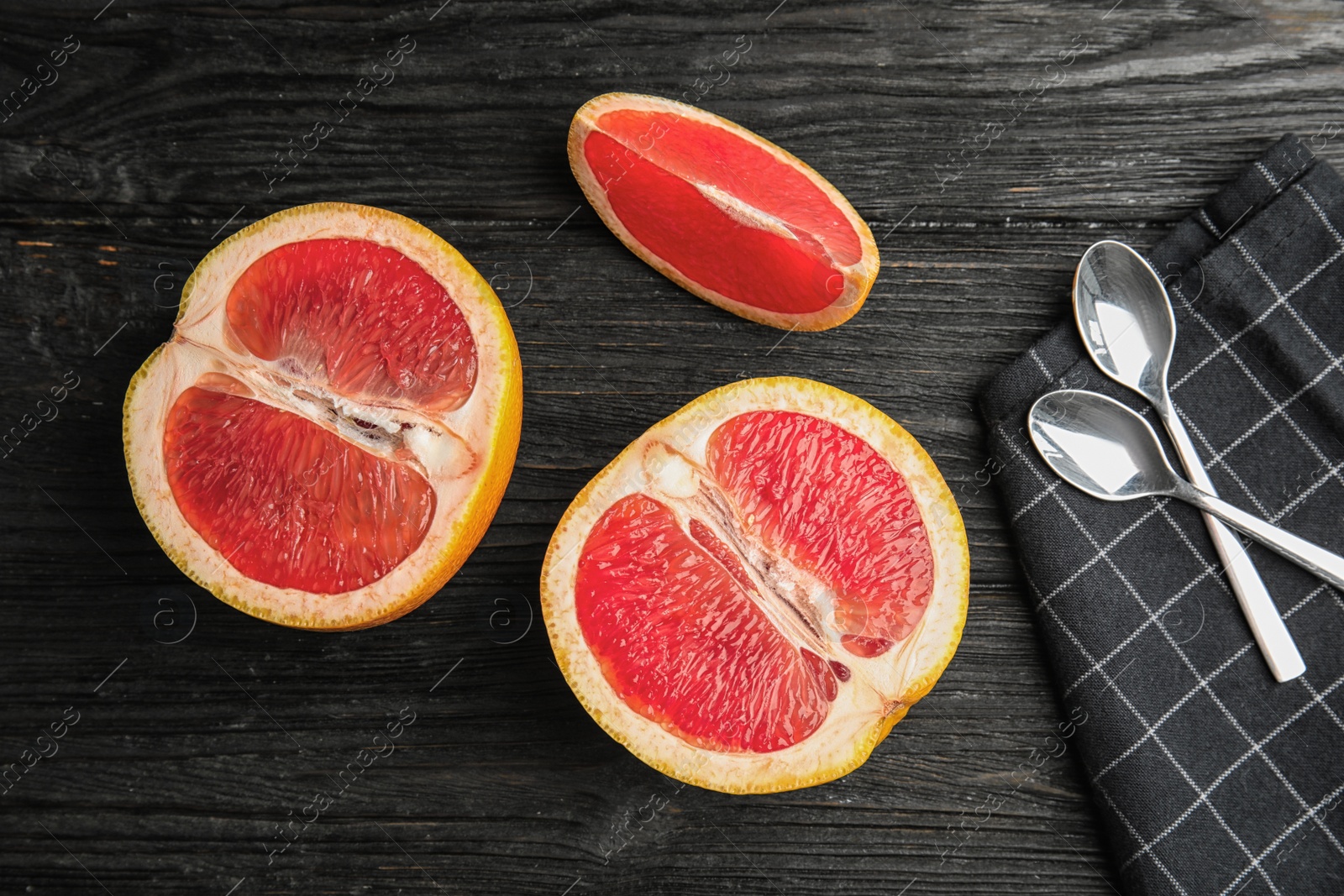 Photo of Flat lay composition with grapefruits on dark wooden background