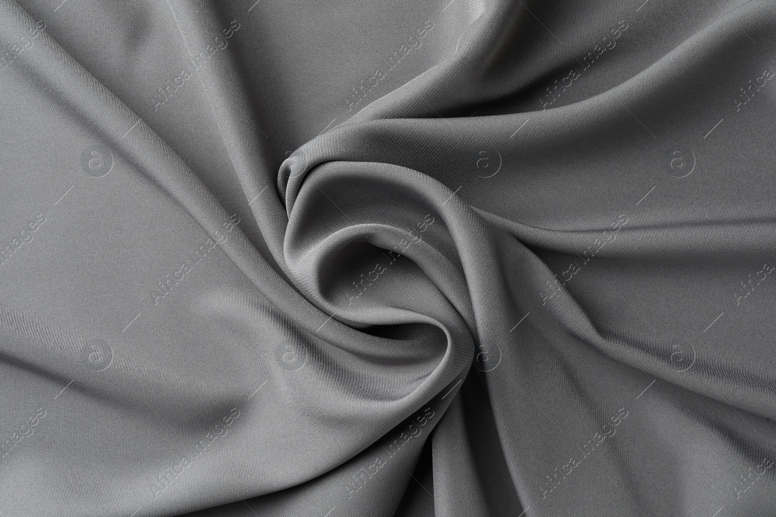 Photo of Texture of grey crumpled silk fabric as background, top view