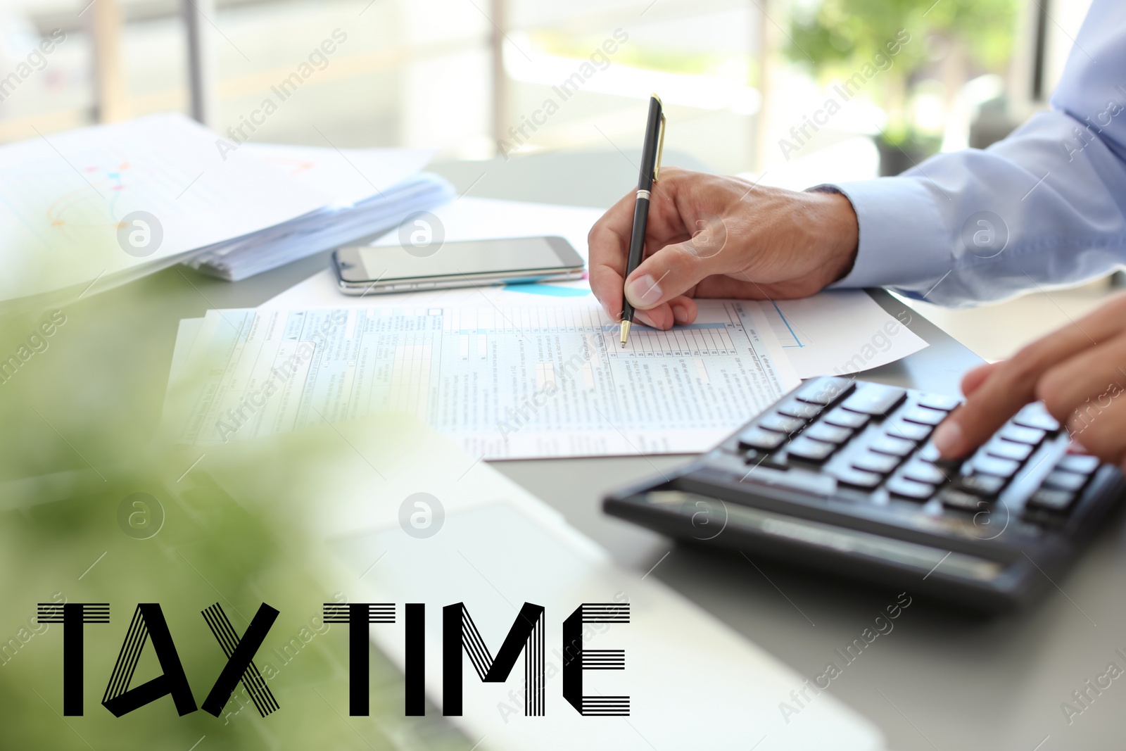 Image of Tax accountant working with documents at table, closeup
