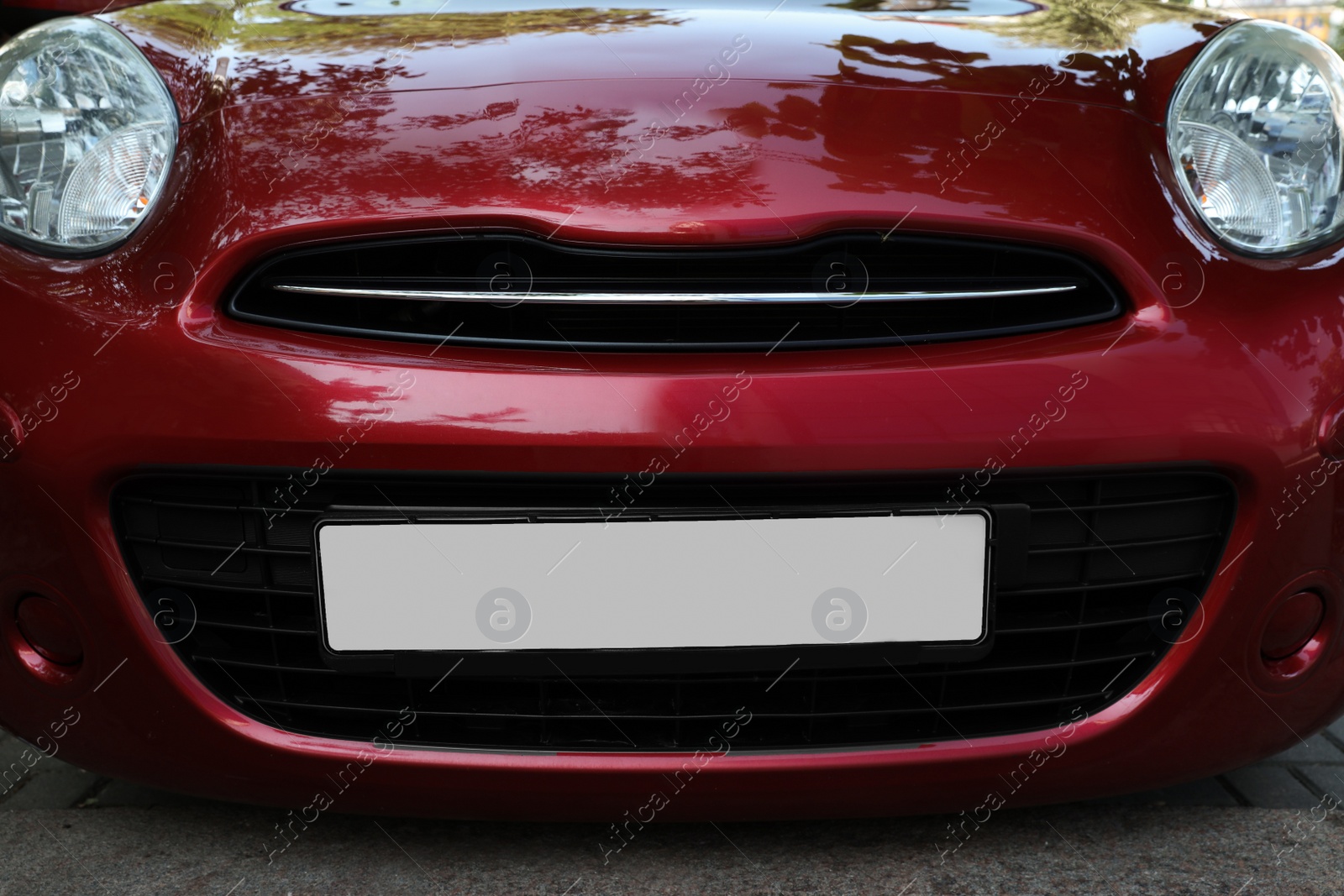 Photo of Car with vehicle registration plate outdoors, closeup