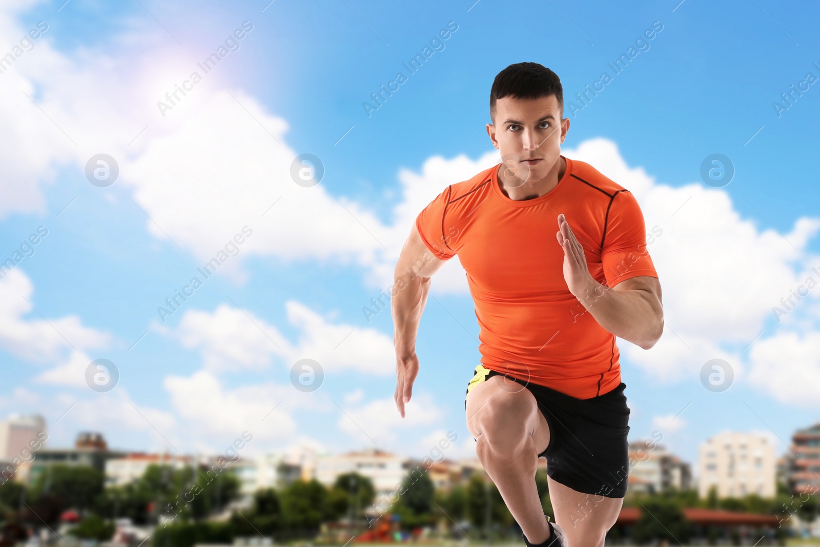 Image of Athletic young man running on sunny day, space for text 