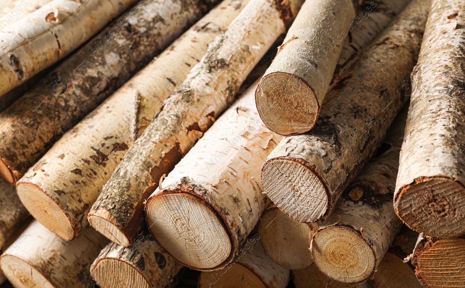 Photo of Cut firewood as background, closeup. Heating in winter